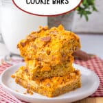 Three butterfinger cookie bars on a plate.