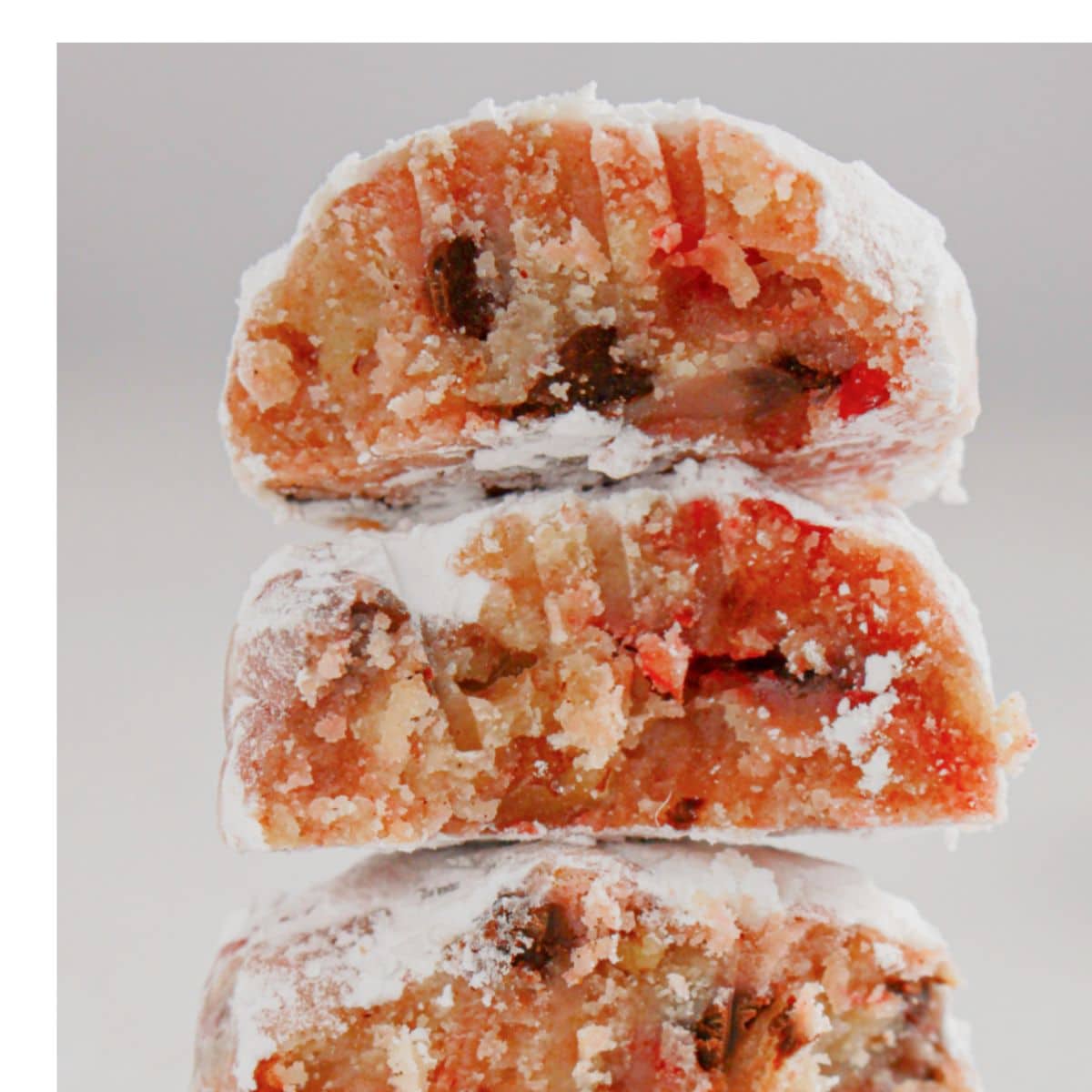 Three cherry cookies stacked on top of each other.