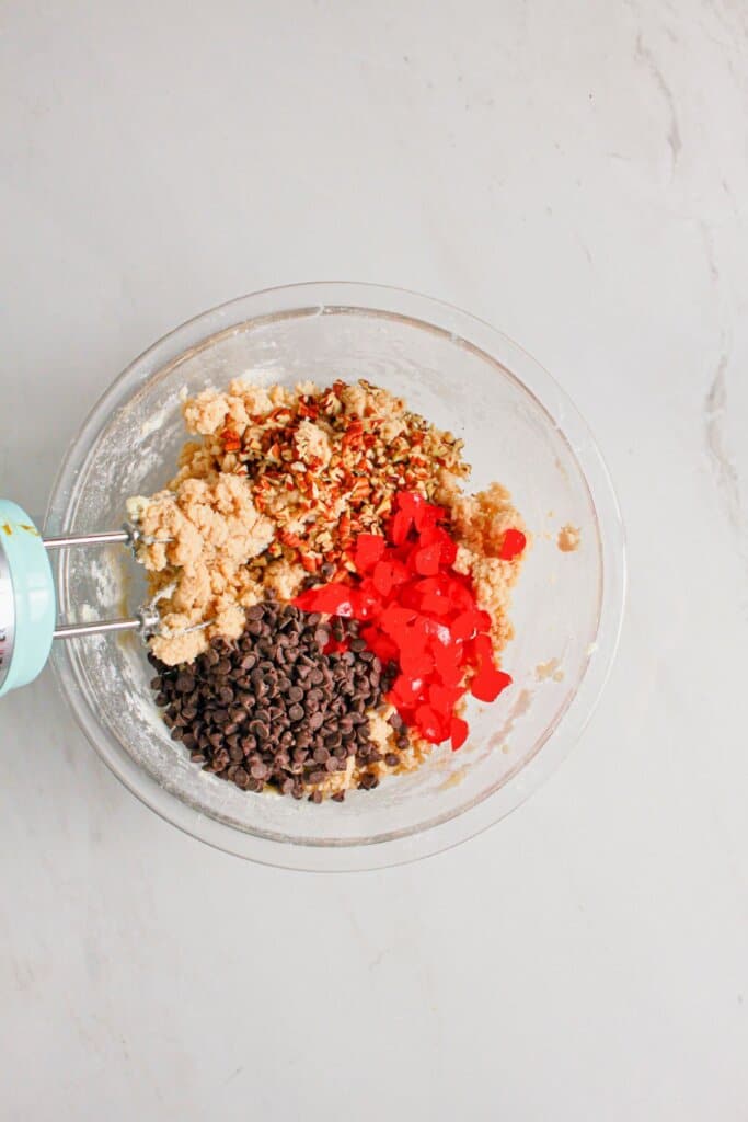 Ingredients being mixed in a large bowl.