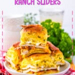 Chicken bacon ranch sliders stacked on a plate.