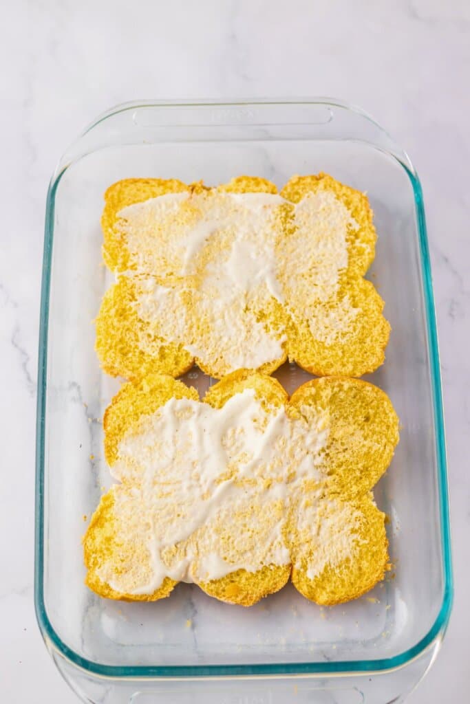 Ranch being spread on buns.