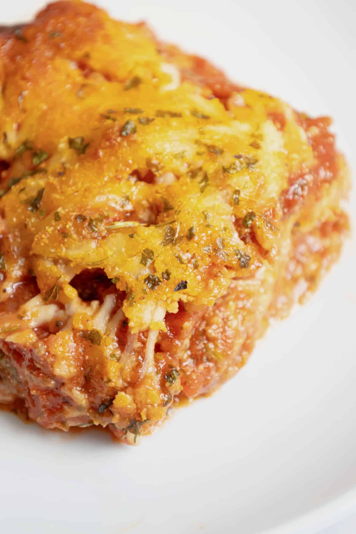 Slice of copycat maggianos lasagna on a plate.