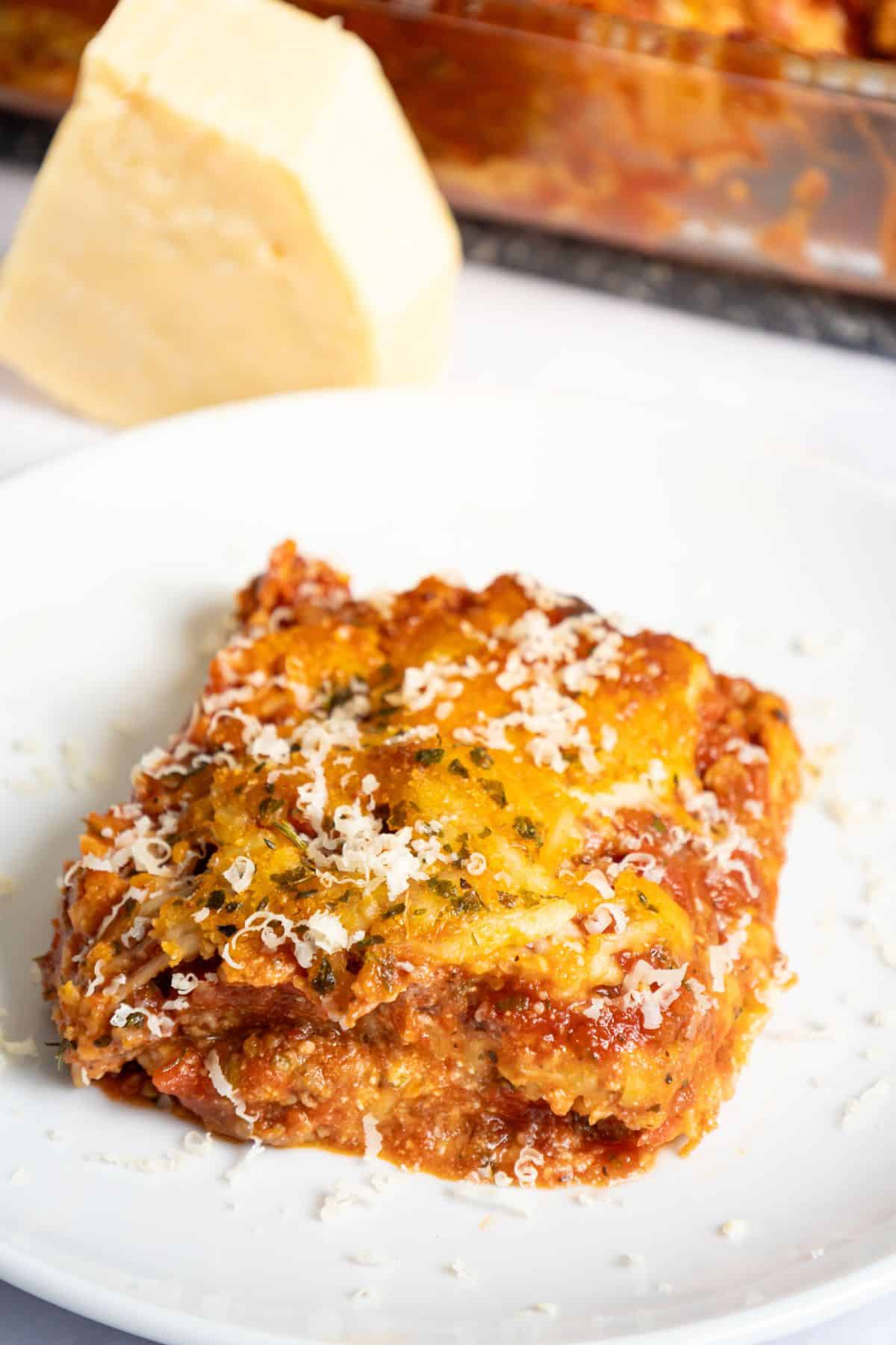 Slice of copycat maggianos lasagna on a plate.