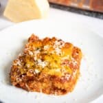 Slice of copycat maggianos lasagna on a plate.