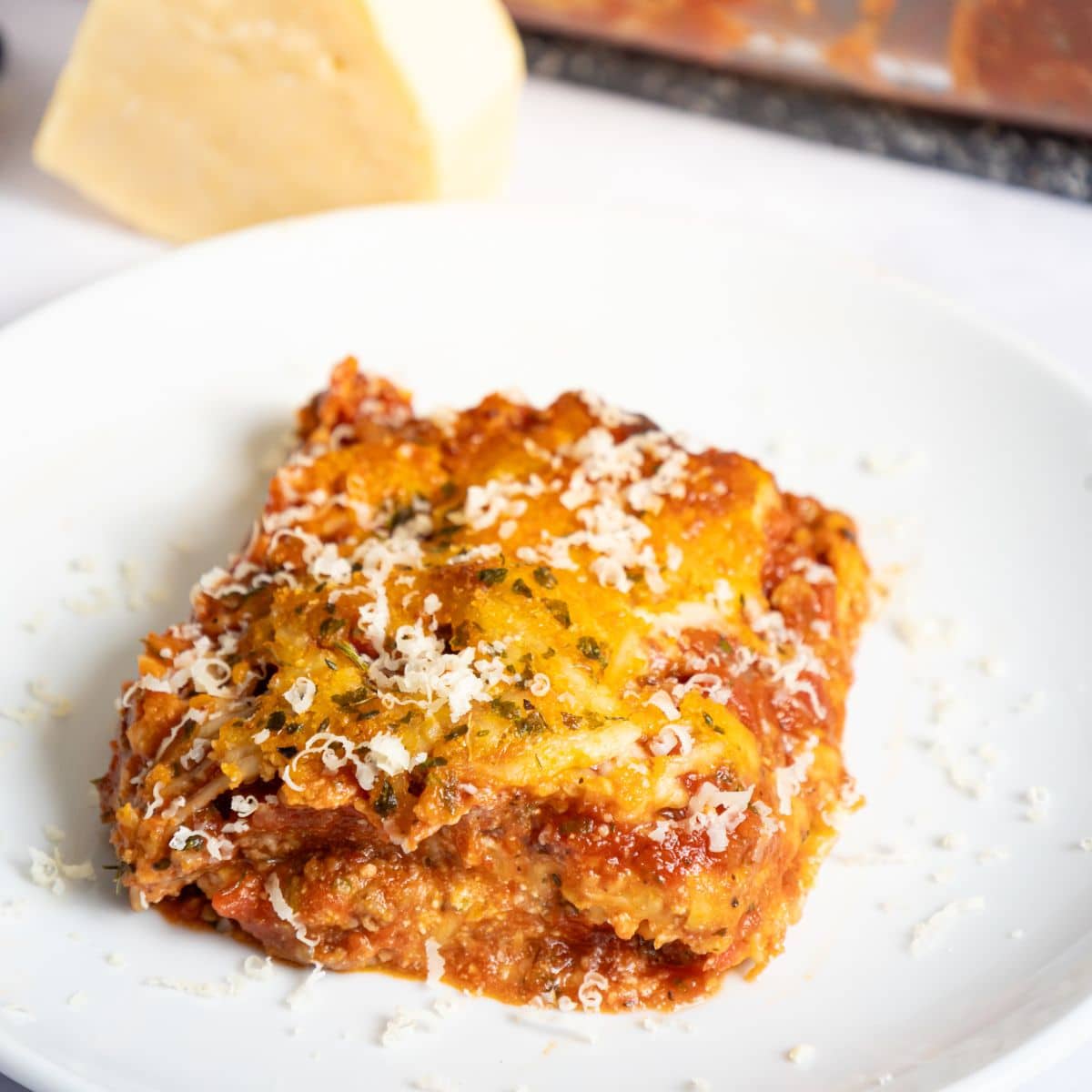 Slice of copycat maggianos lasagna on a plate.
