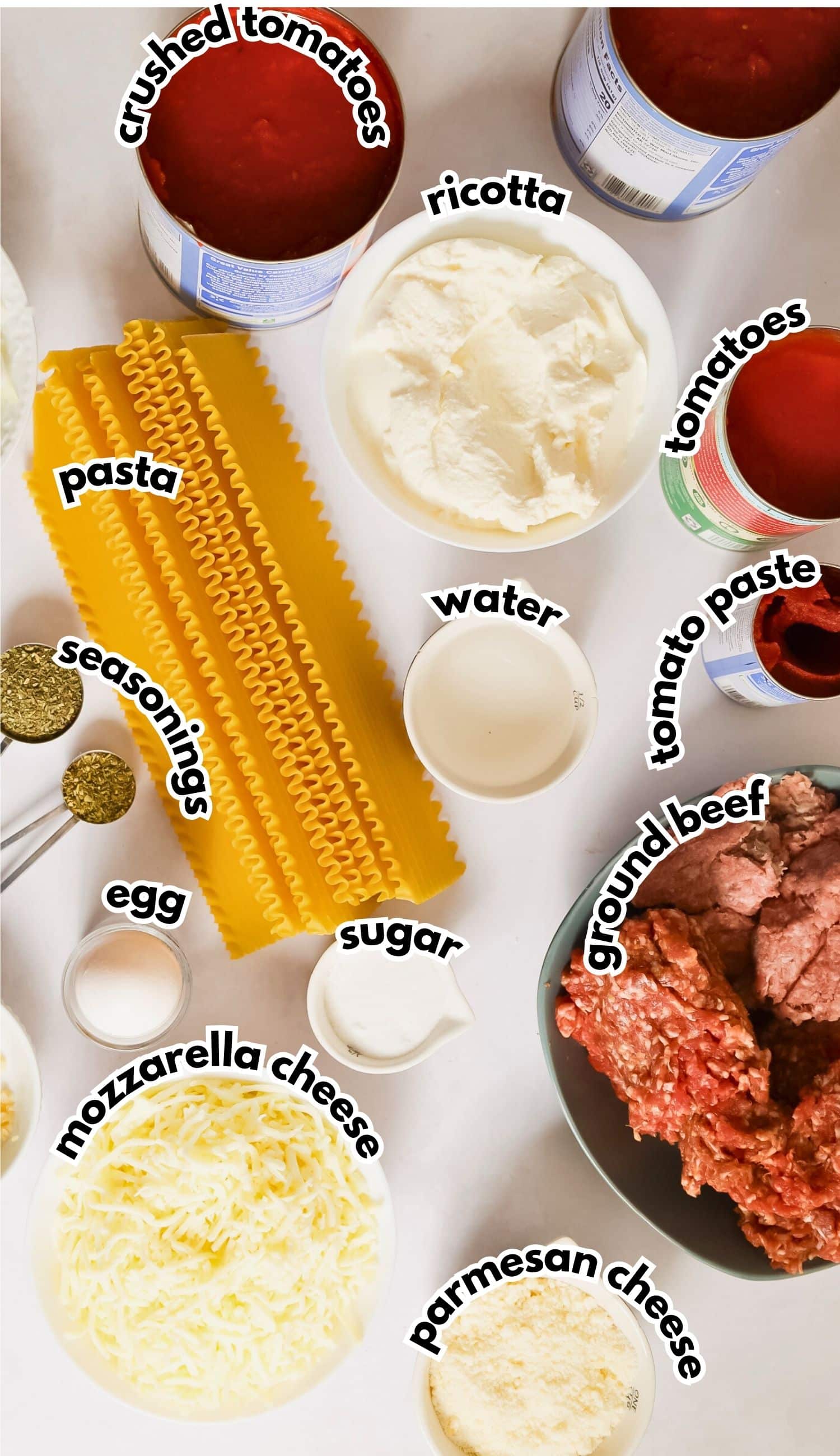 Bowls of ingredients labelled with text on a counter.