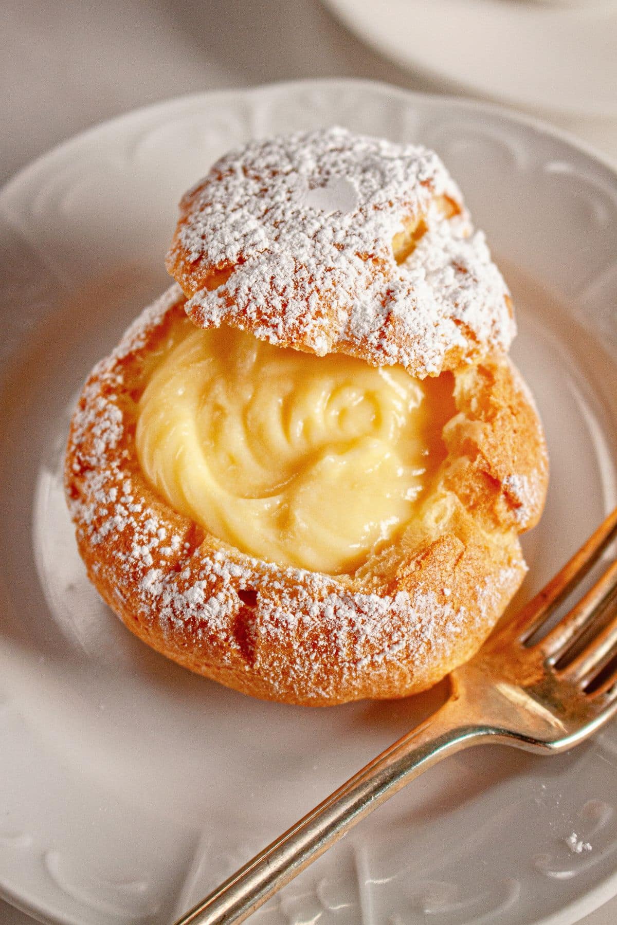 Cream puffs on a plate.