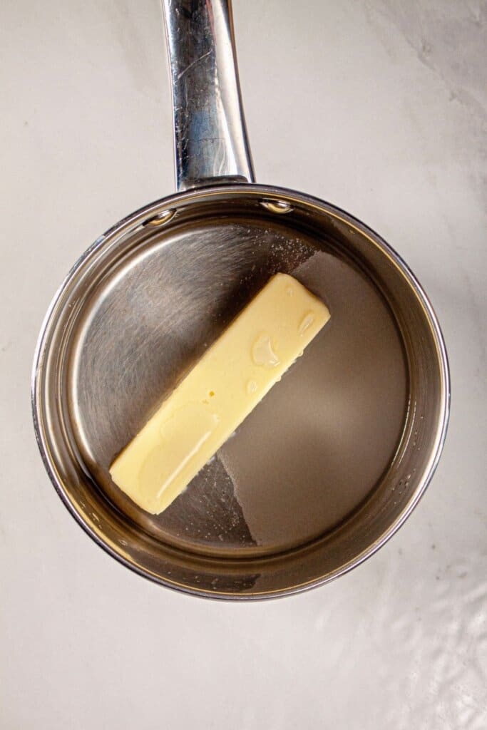 Butter, water, and sugar in a saucepan.