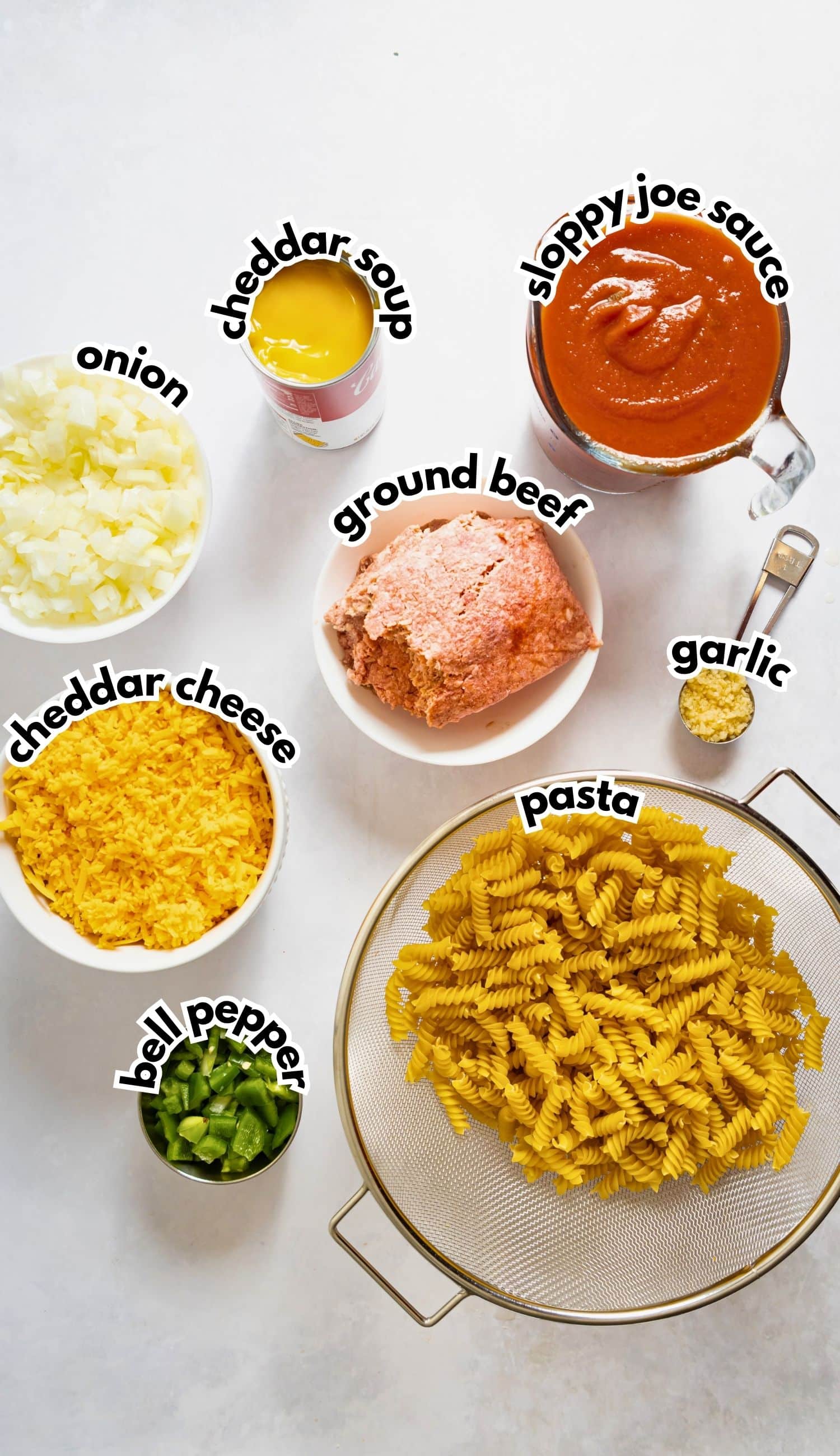 Bowls of ingredients labelled with text on a counter.