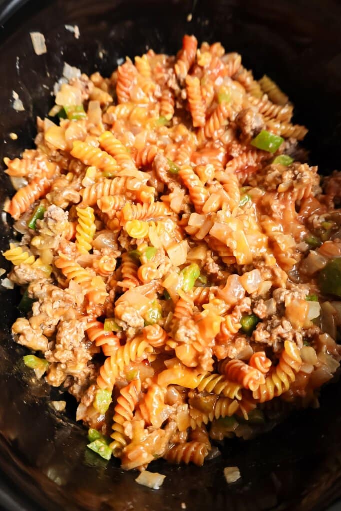 Pasta and meat in a slow cooker.