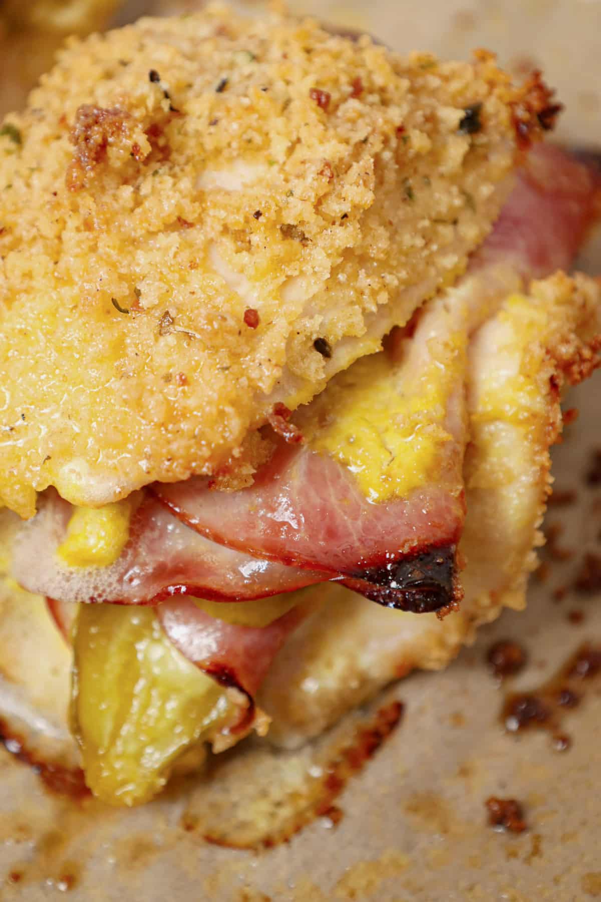 Piece of cubano chicken on a baking sheet.