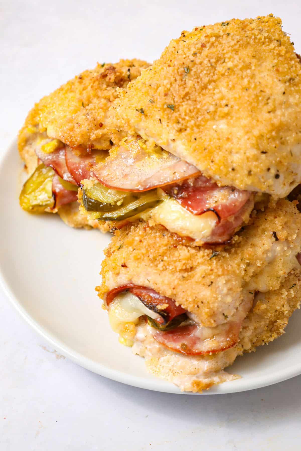 Three pieces of cubano chicken on a plate.