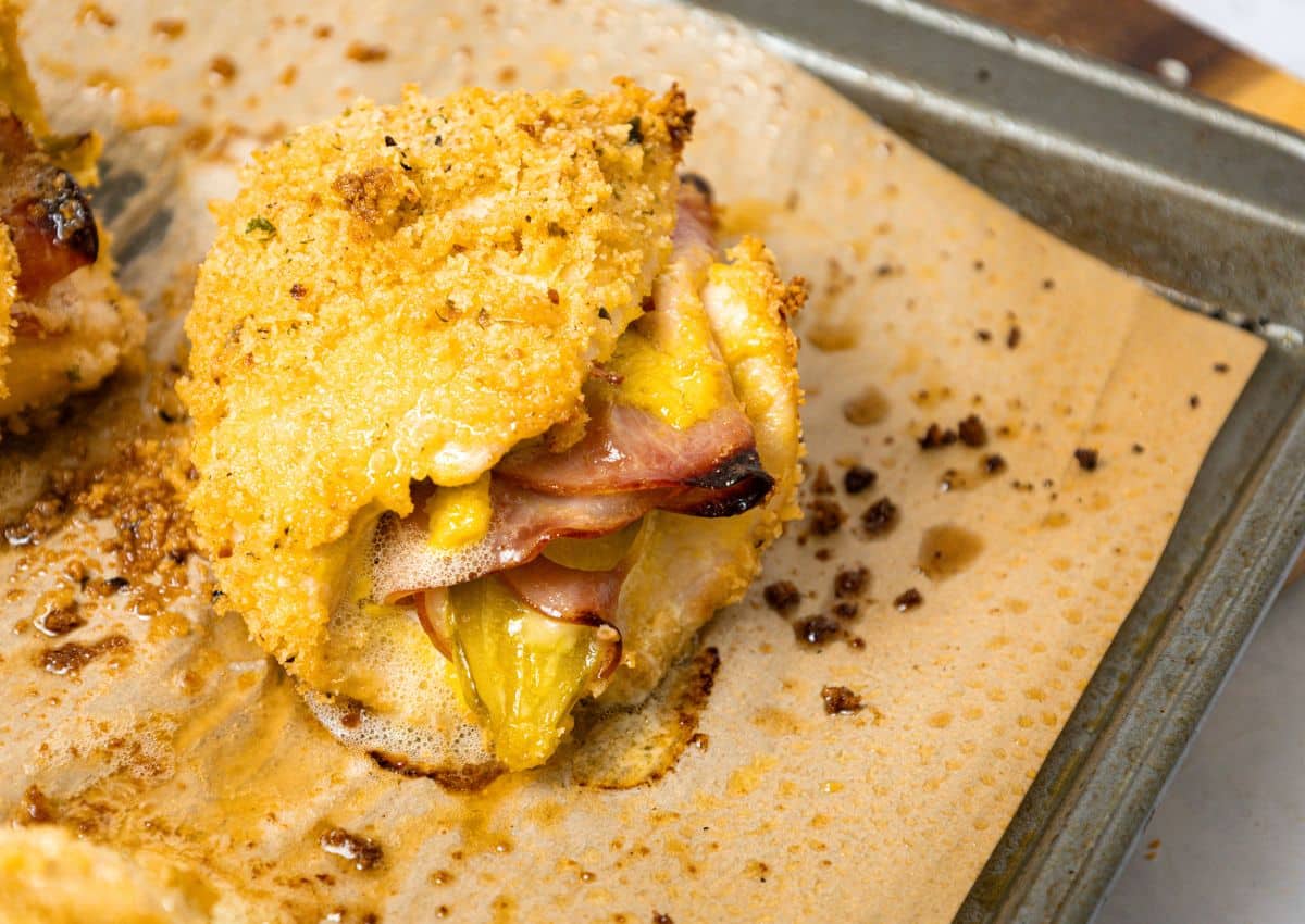 Piece of cubano chicken on a baking sheet.