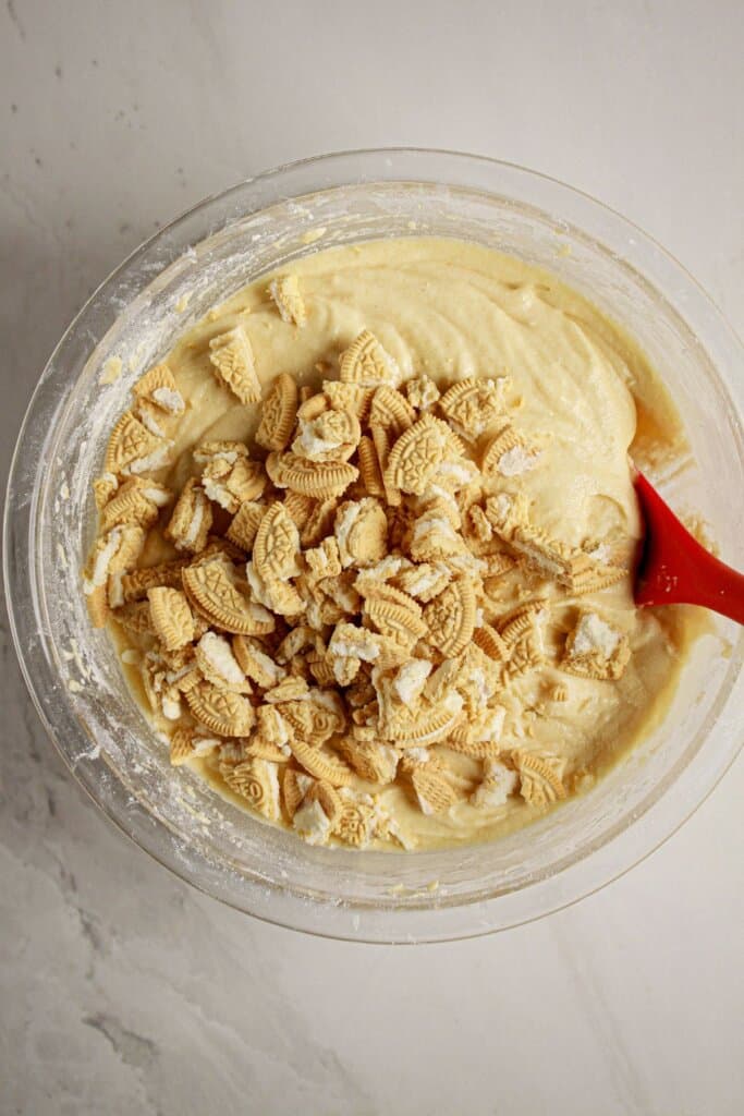 Cookie pieces being folded into batter.