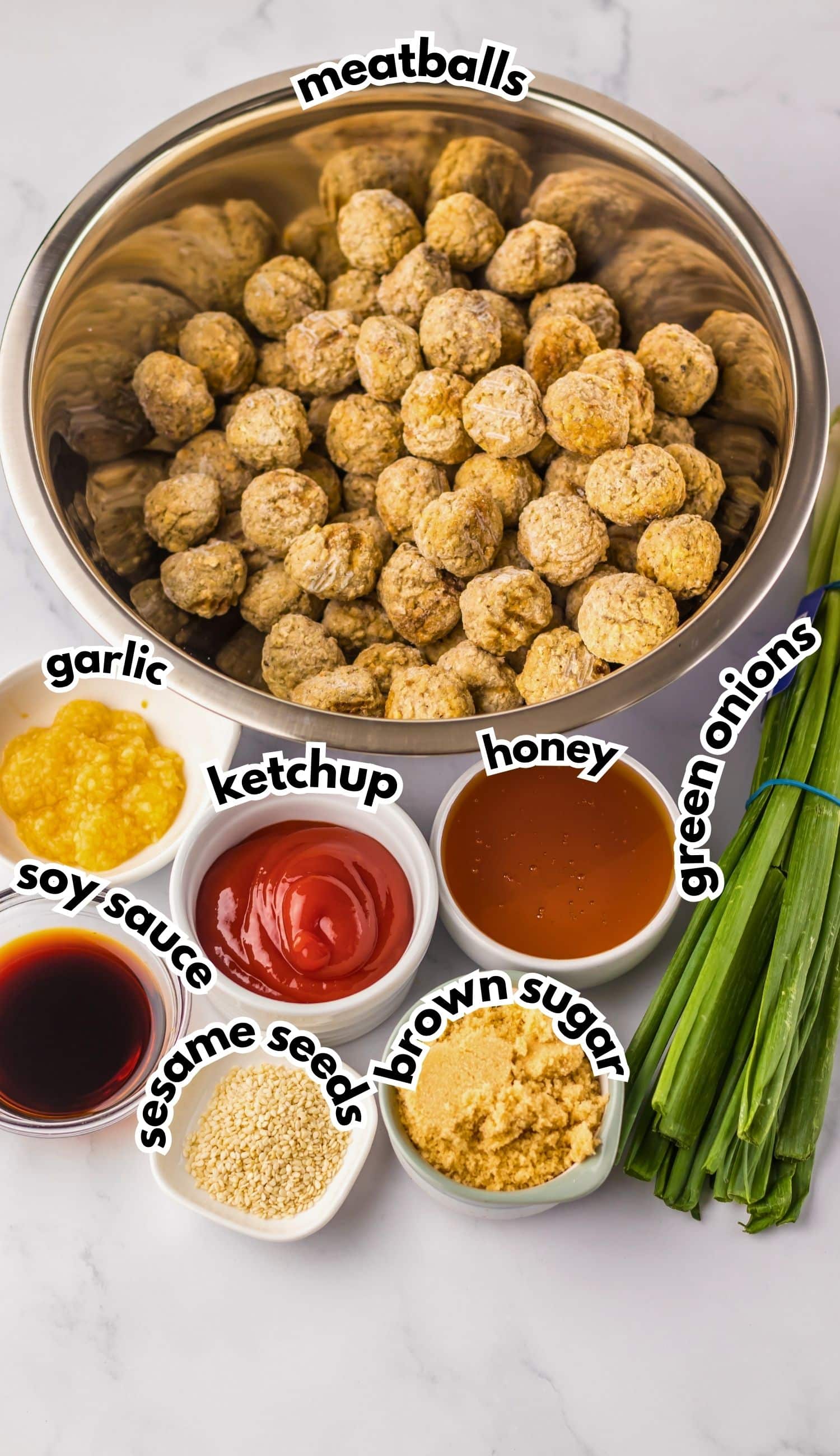Bowls of ingredients labeled with text on a counter.