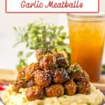 Mashed potatoes topped with honey garlic meatballs .