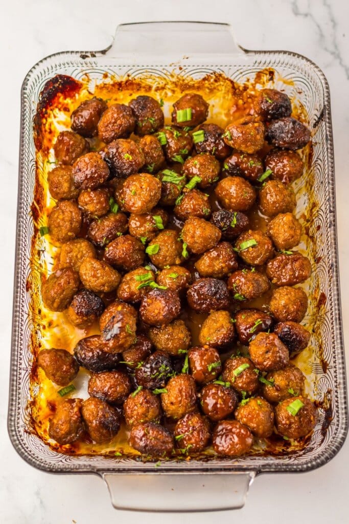 Meatballs in a glass baking dish.