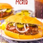 Mcrib sandwich on a plate with some fries.