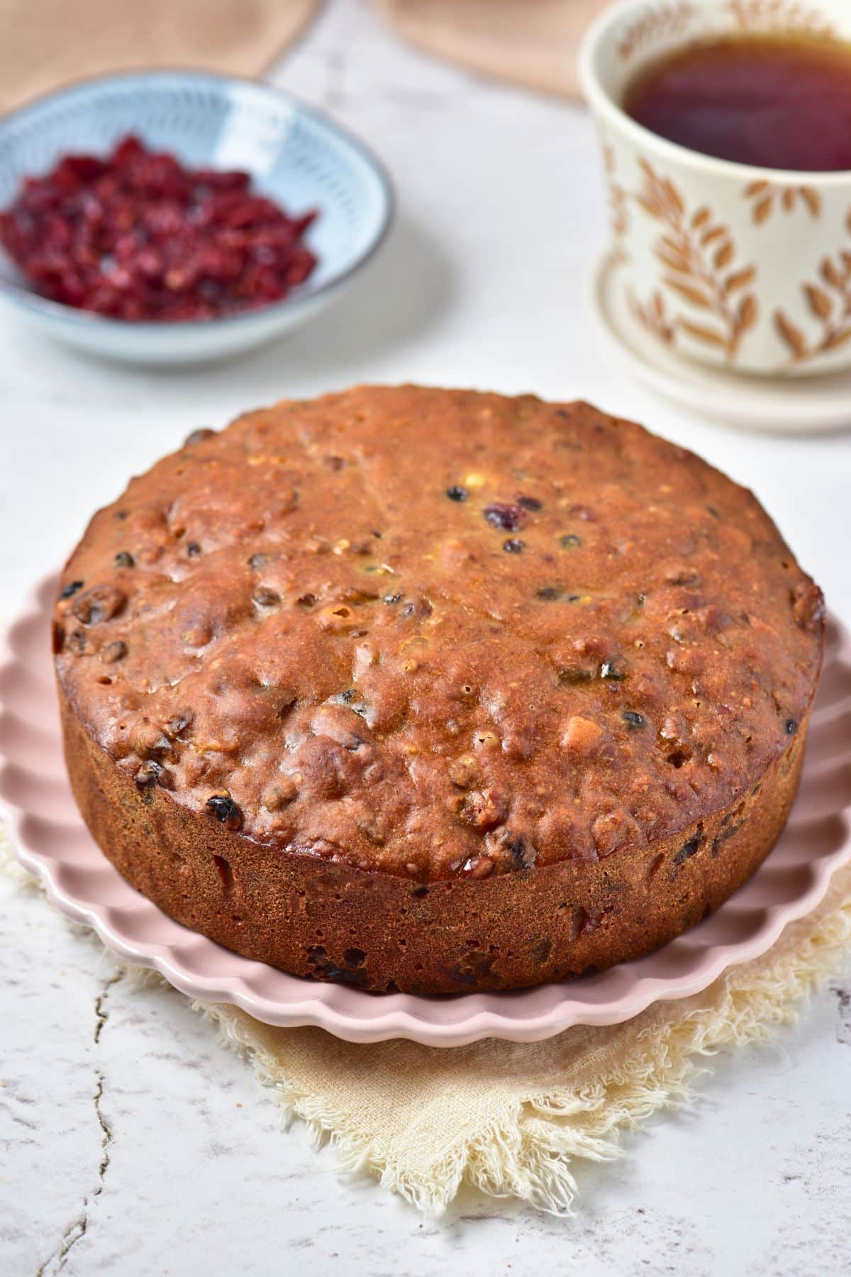Whole fruit cake on a platter.