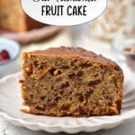Slice of fruit cake on a plate.