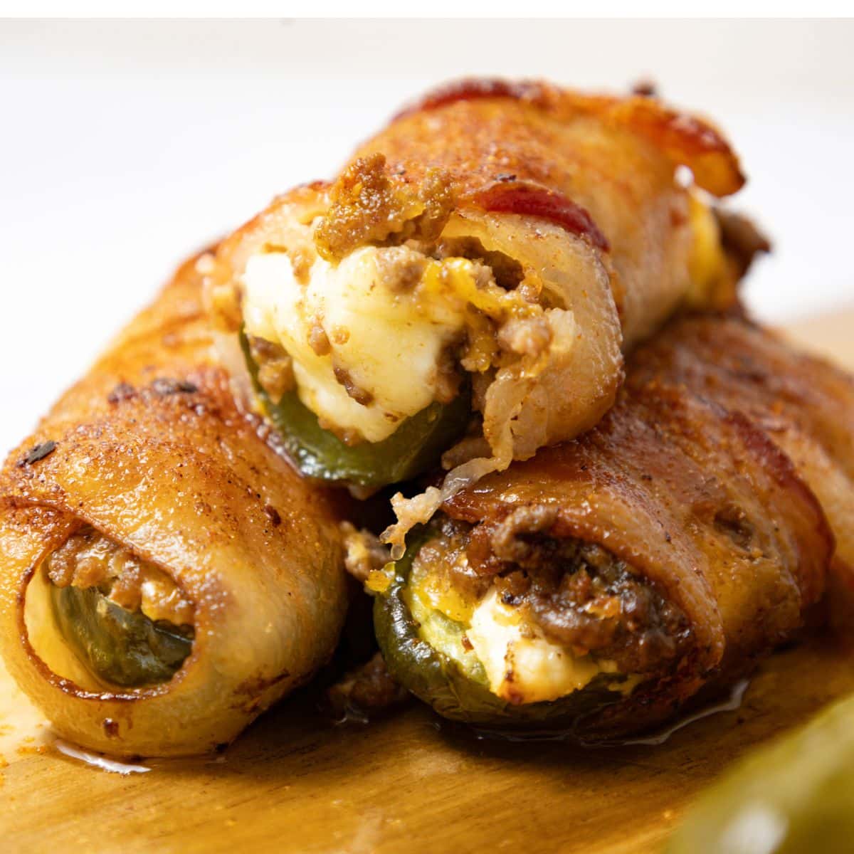 Pickle poppers on a cutting board.