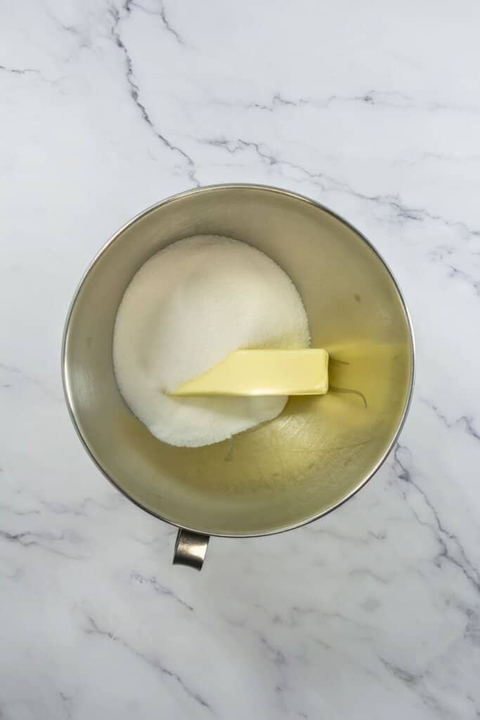 Butter and sugar in a mixing bowl.