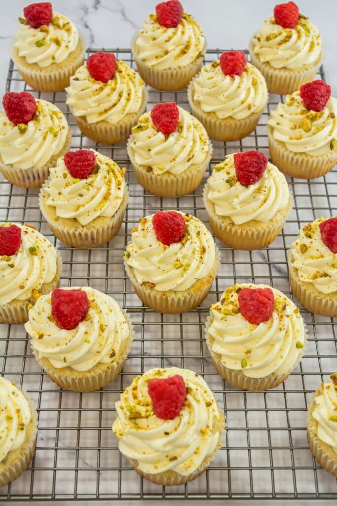 Cupcakes on a wire baking rack.