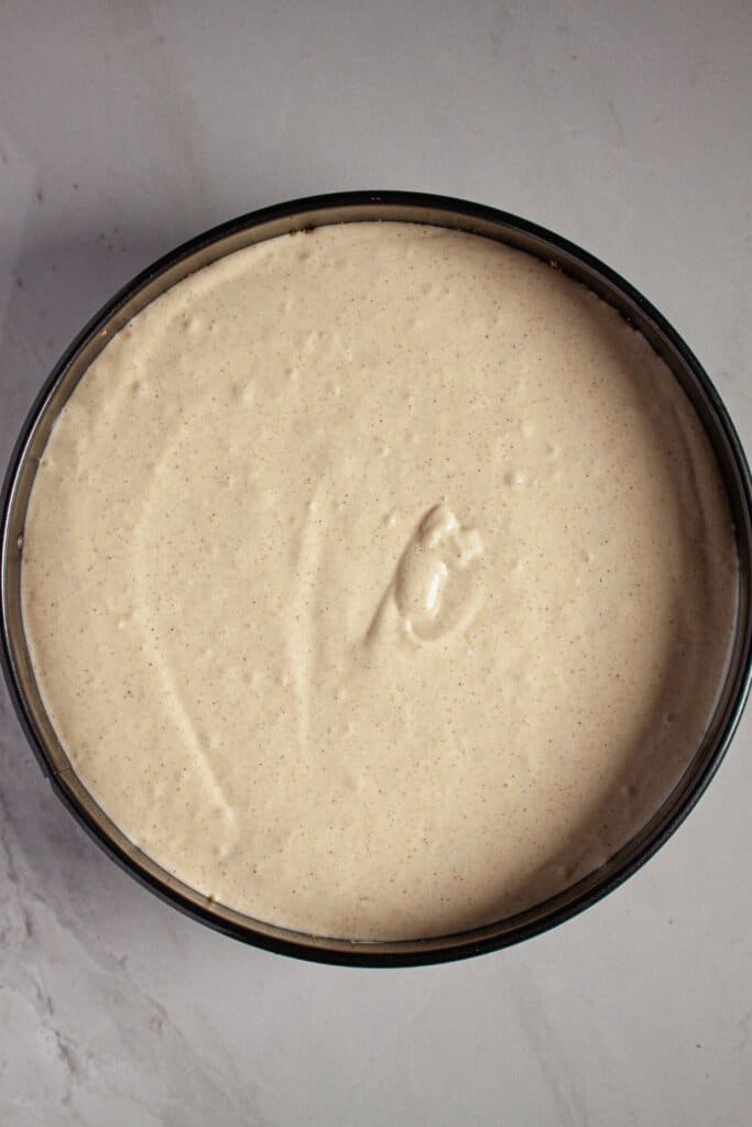 Batter poured into a springform pan ready for the oven.