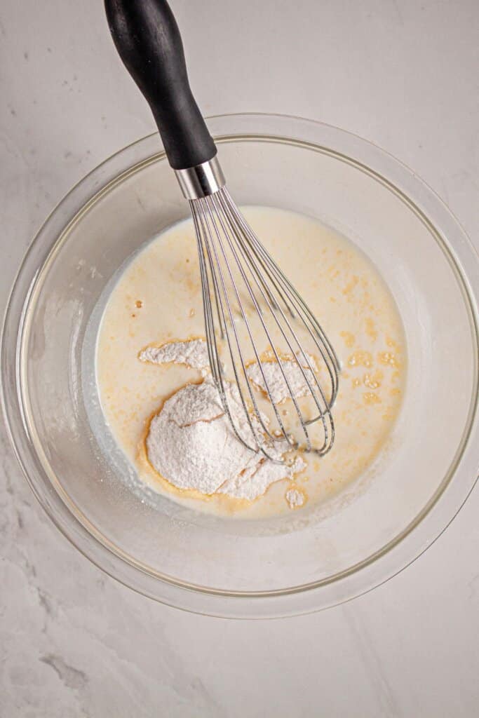Ingredients being whisked in a bowl.