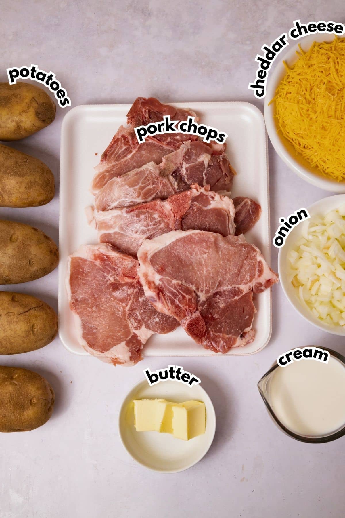 Bowls of ingredients labelled with text on a counter.