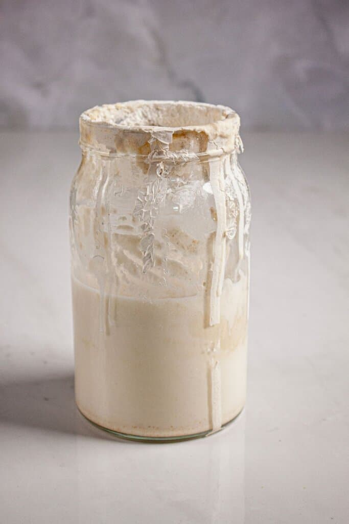 Sourdough starter in a glass jar.