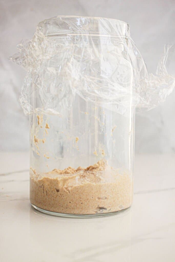 Sourdough starter in a glass jar.