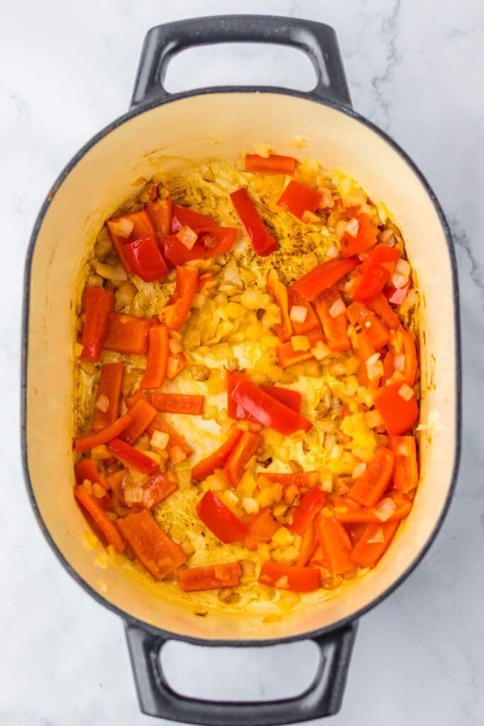 Vegetables being cooked in a large pot.