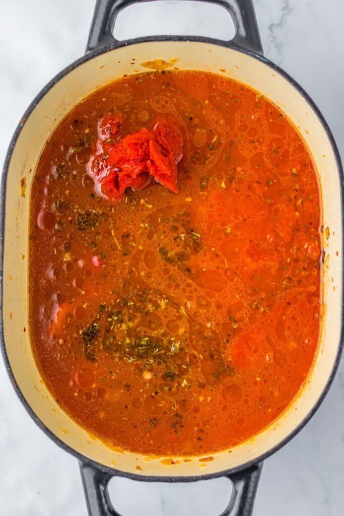 Tomatoes and seasoning in a large pot.