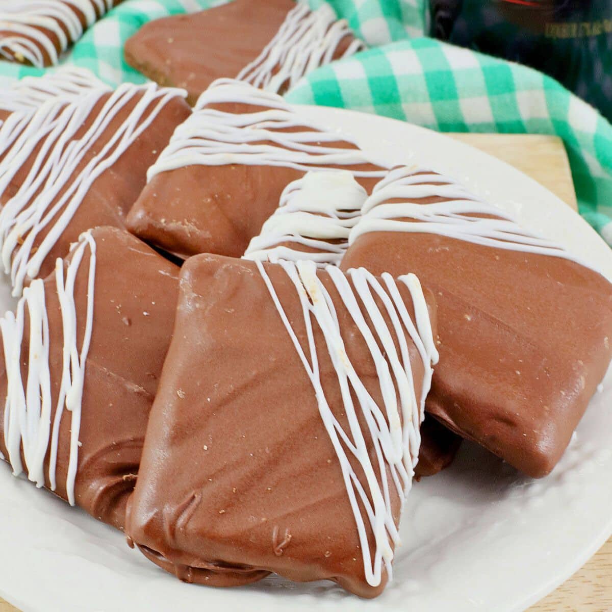 Bailey's graham crackers stacked on a white plate.