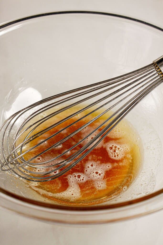 Browned butter in a glass mixing bowl.