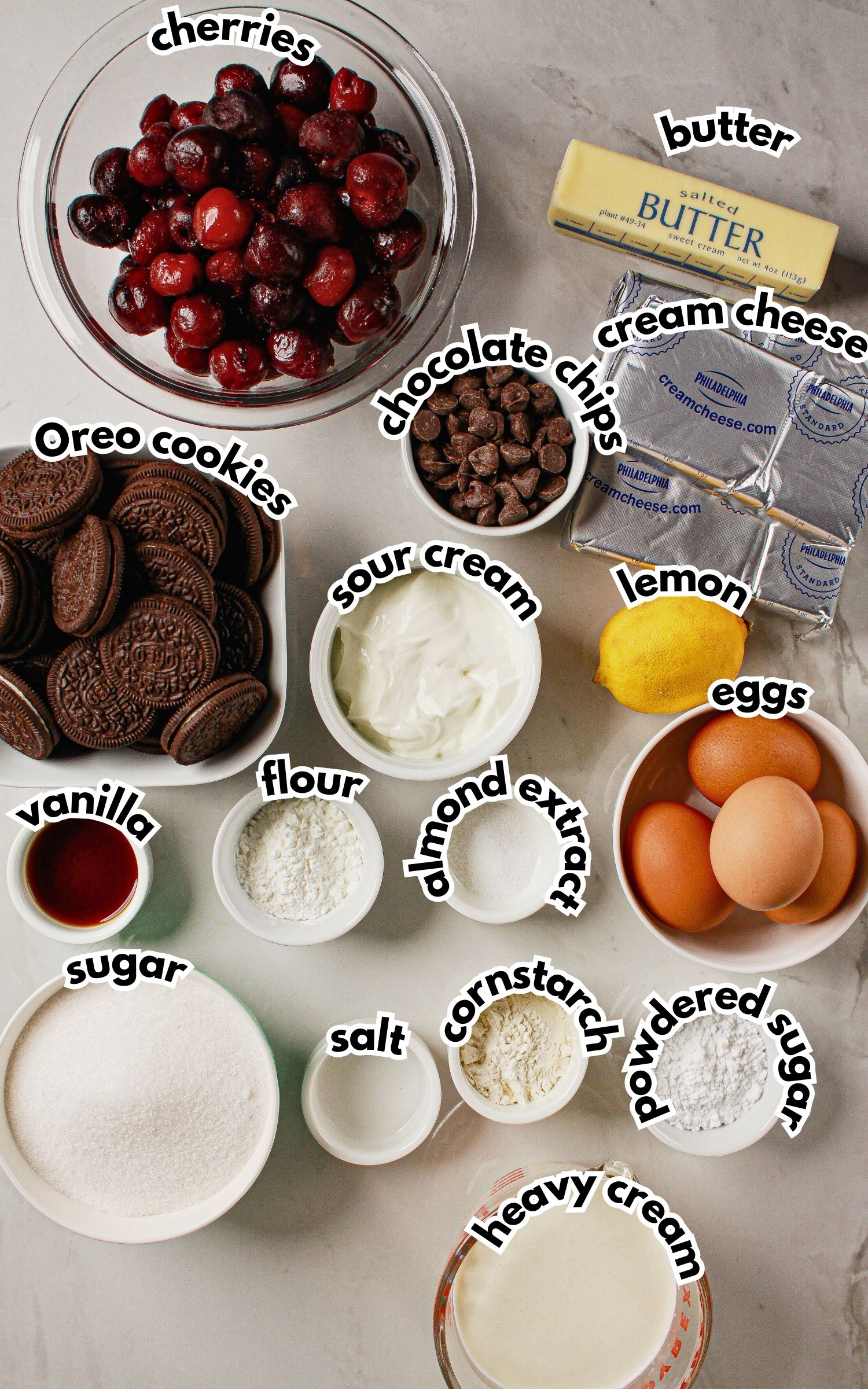 Bowls of ingredients labelled with text on a counter.