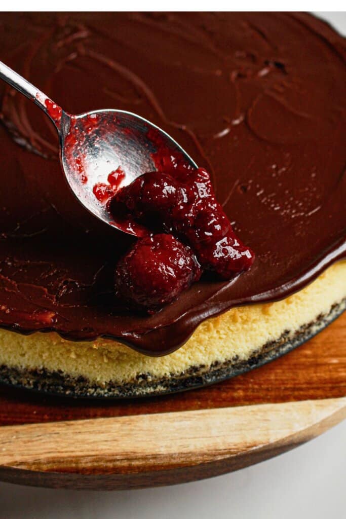 Fruit filling being spread on top of dessert.