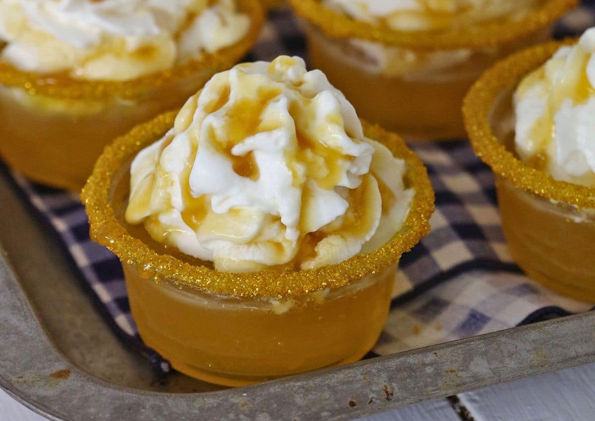 Butterbeer shots on a metal baking sheet.