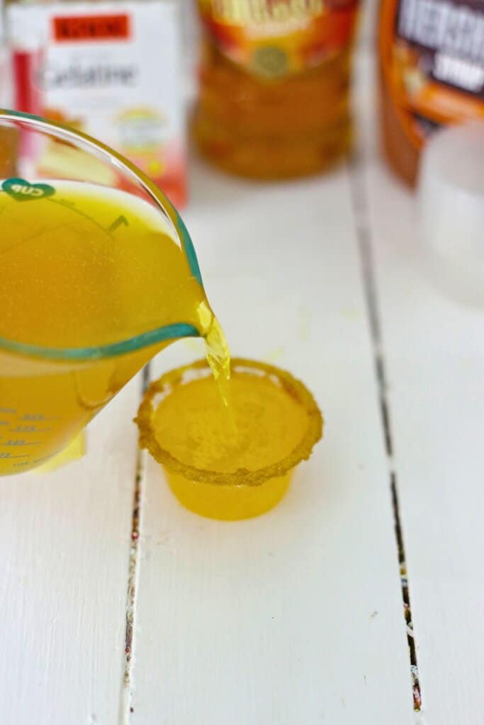 Mixture being poured into a small cup.