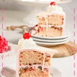 Slice of cherry chip cake on a small plate.