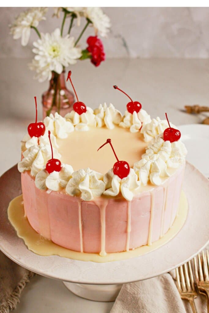 Whole cake on a cake plate ready to serve.