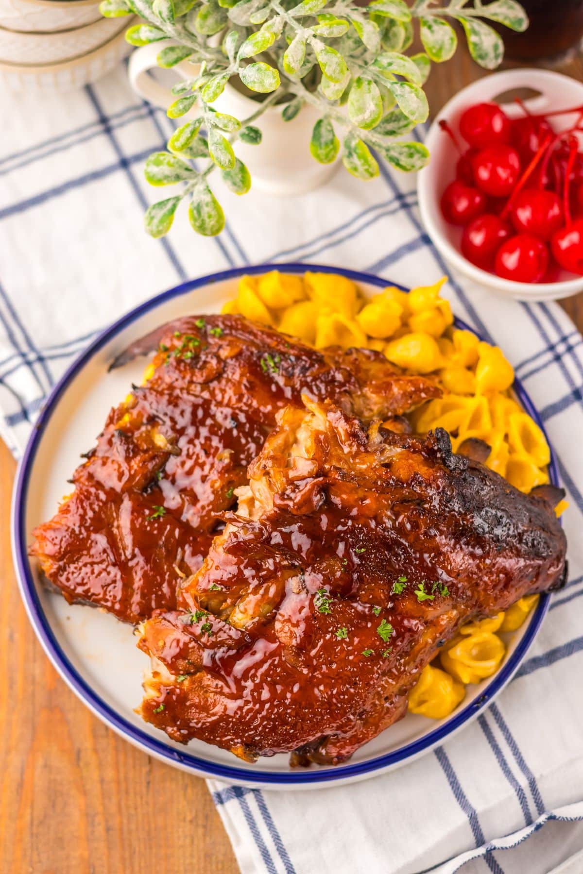 Ribs on a plate with mac and cheese.