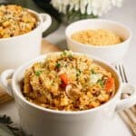 French onion pasta in a small white bowl.