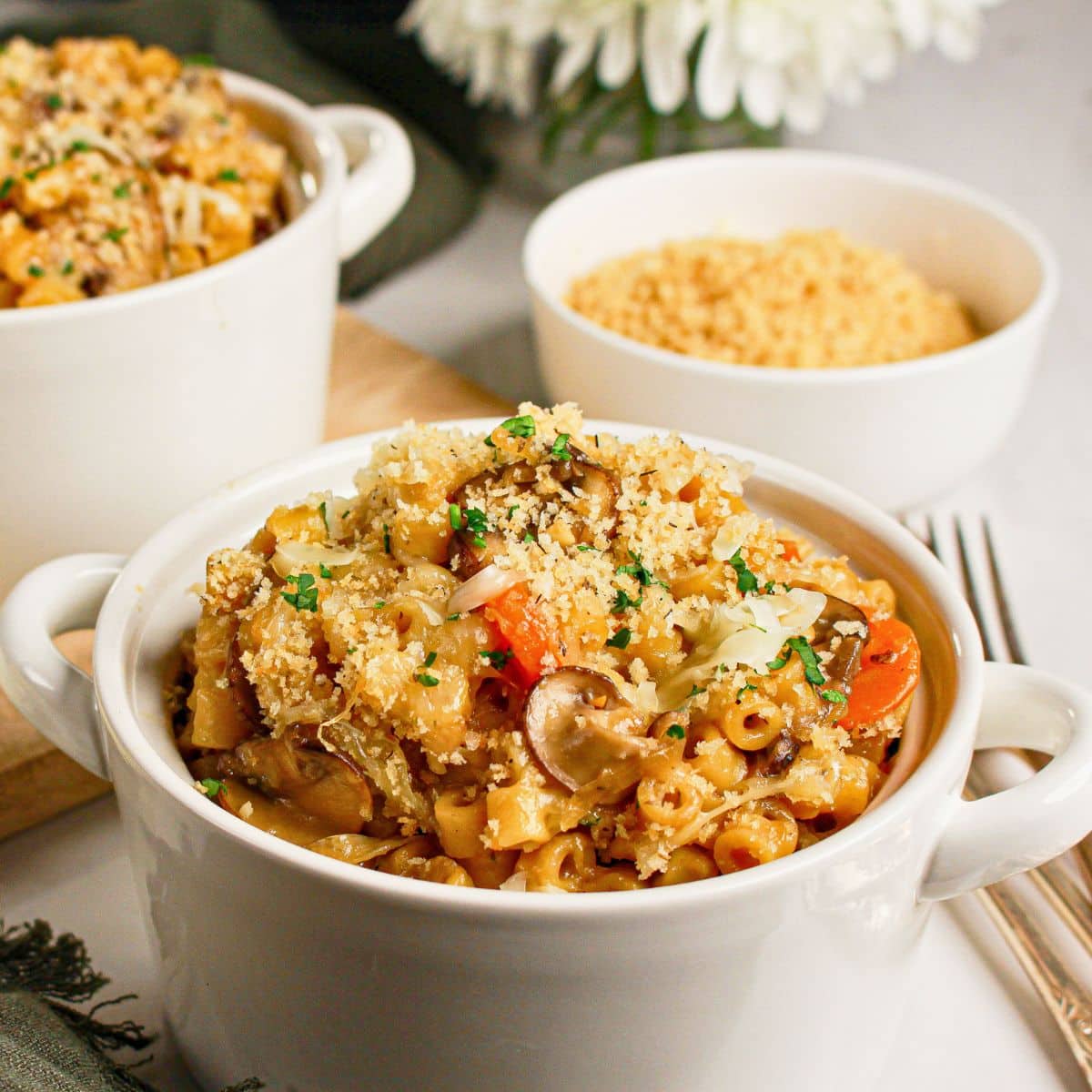 French onion pasta in a small white bowl.