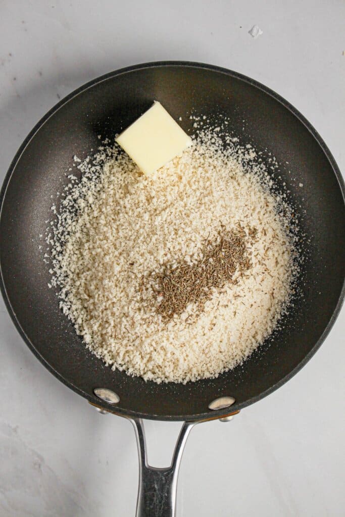 Bread crumbs, seasonings, and butter in a skillet.