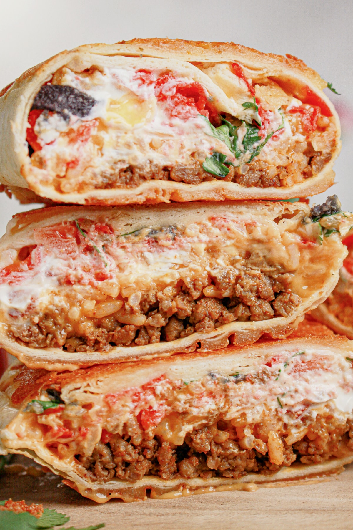 Grilled cheese burrito cut in half.