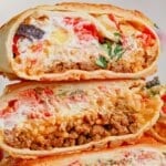 Grilled cheese burrito cut in half.