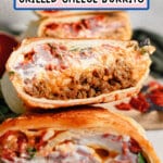 Grilled cheese burrito cut in half.