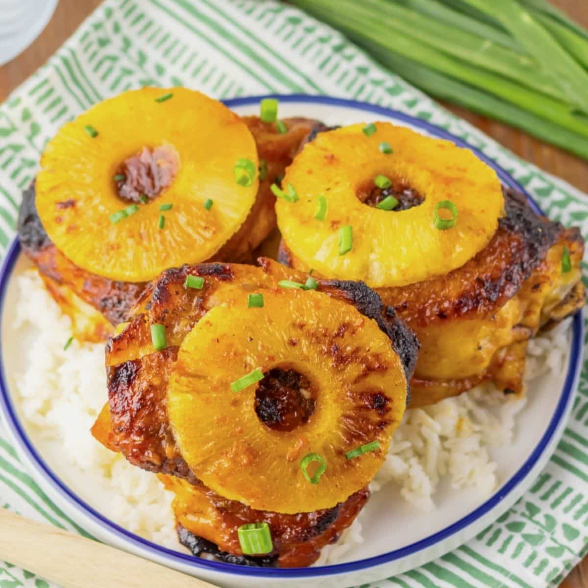 Plate with rice and hulu huli chicken thighs.